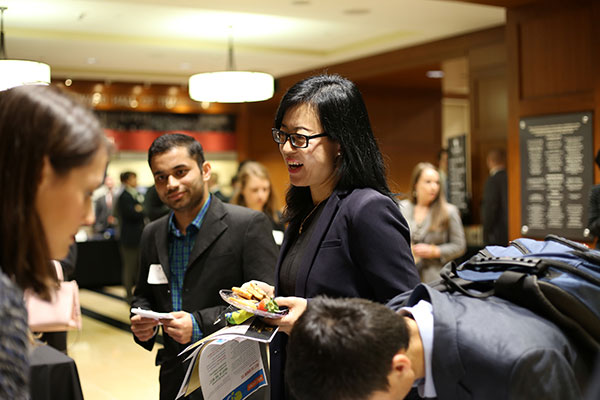 Students talking during a networking event.